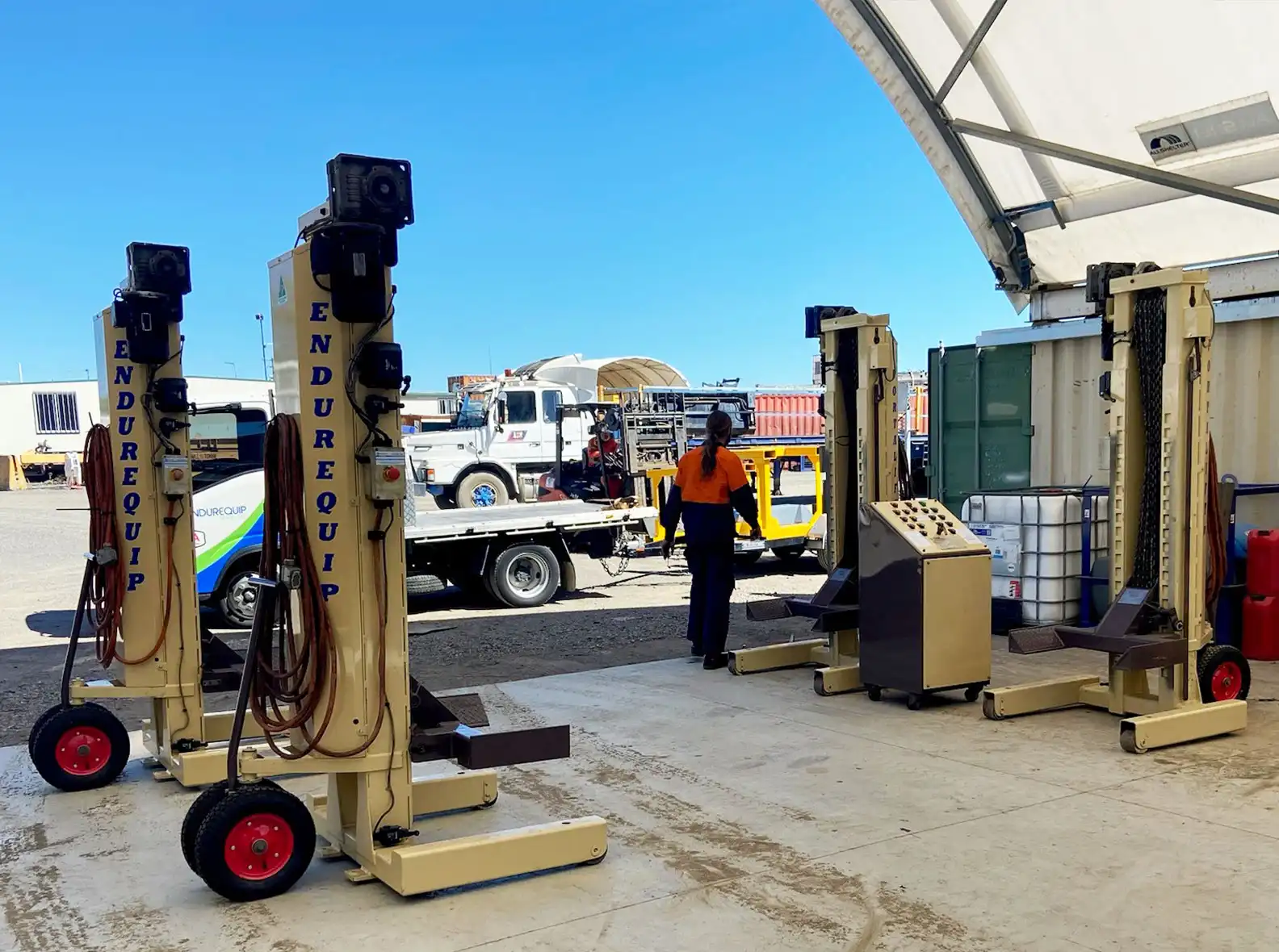 Portable heavy vehicle hoists ready work for lifting trucks, cars, rail and bus servicing.